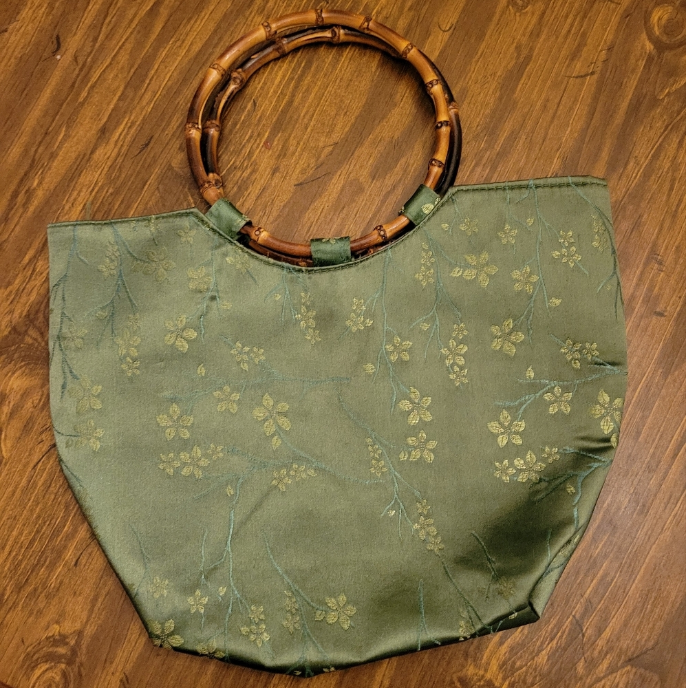 Green purse with bamboo handles
